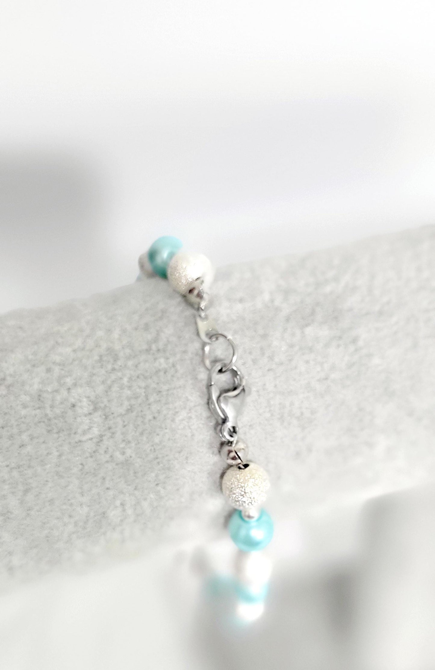Ice blue glass beaded snowflake charm bracelet