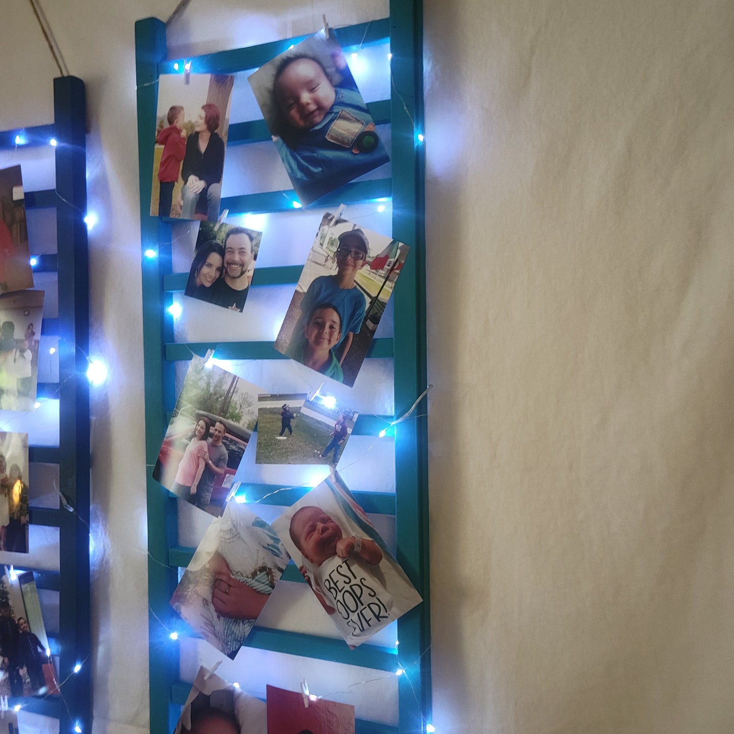 Repurposed Wood Ladder Photo Display: Vintage Crib Frame with Fairy Lights