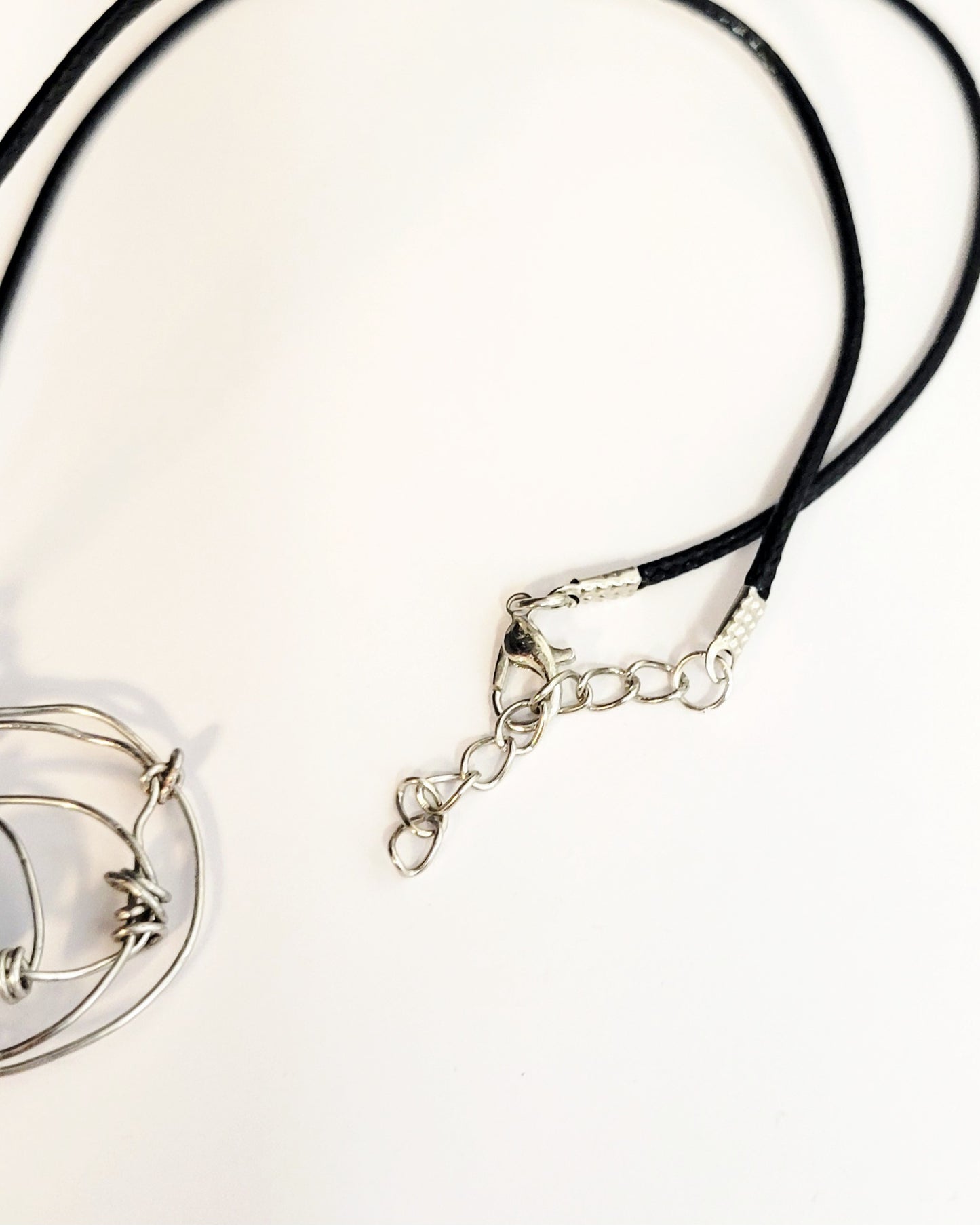 Minimalist knotted wire necklace with dragon vein agate bead