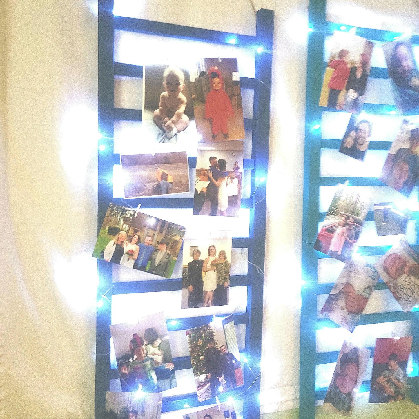 Repurposed Wood Ladder Photo Display: Vintage Crib Frame with Fairy Lights