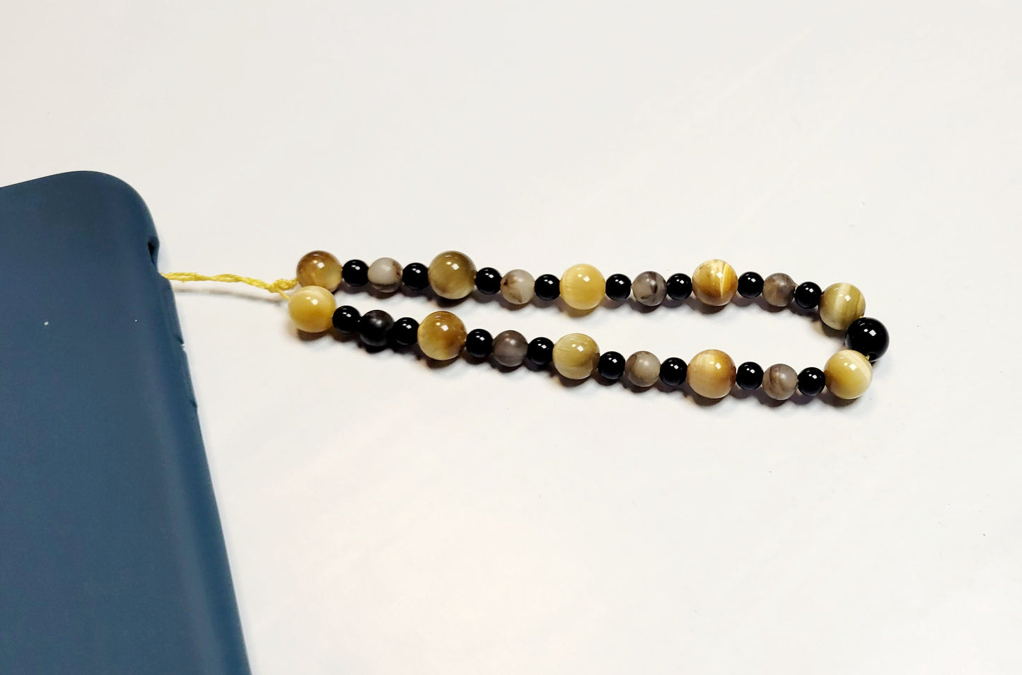 Cellphone charm strap wristlet accessory