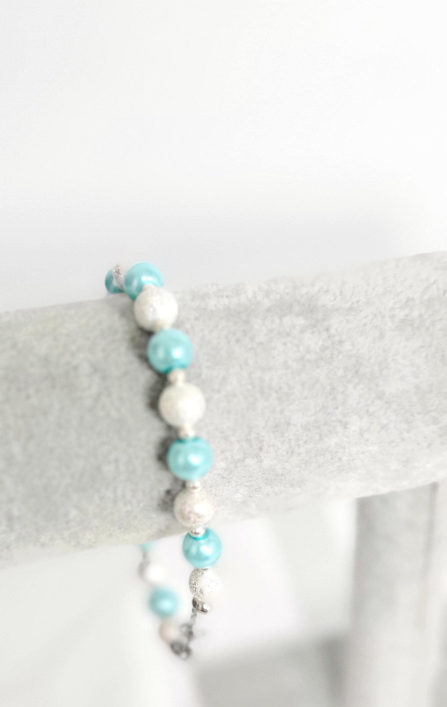 Ice blue glass beaded snowflake charm bracelet