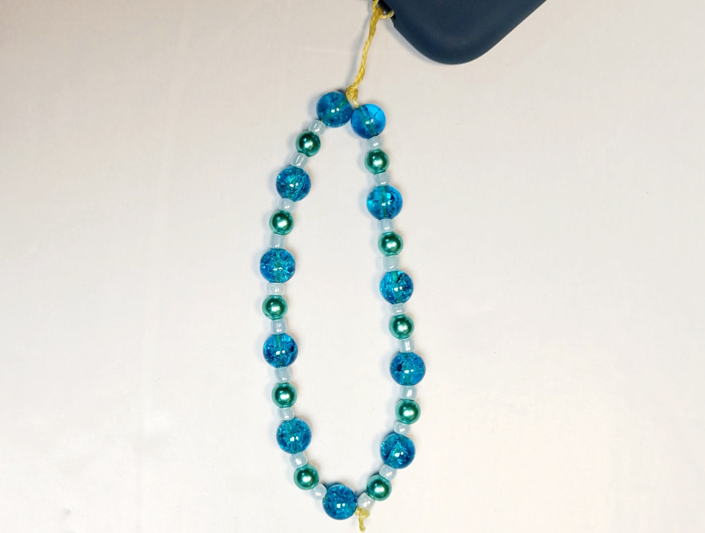 Cellphone charm strap wristlet accessory