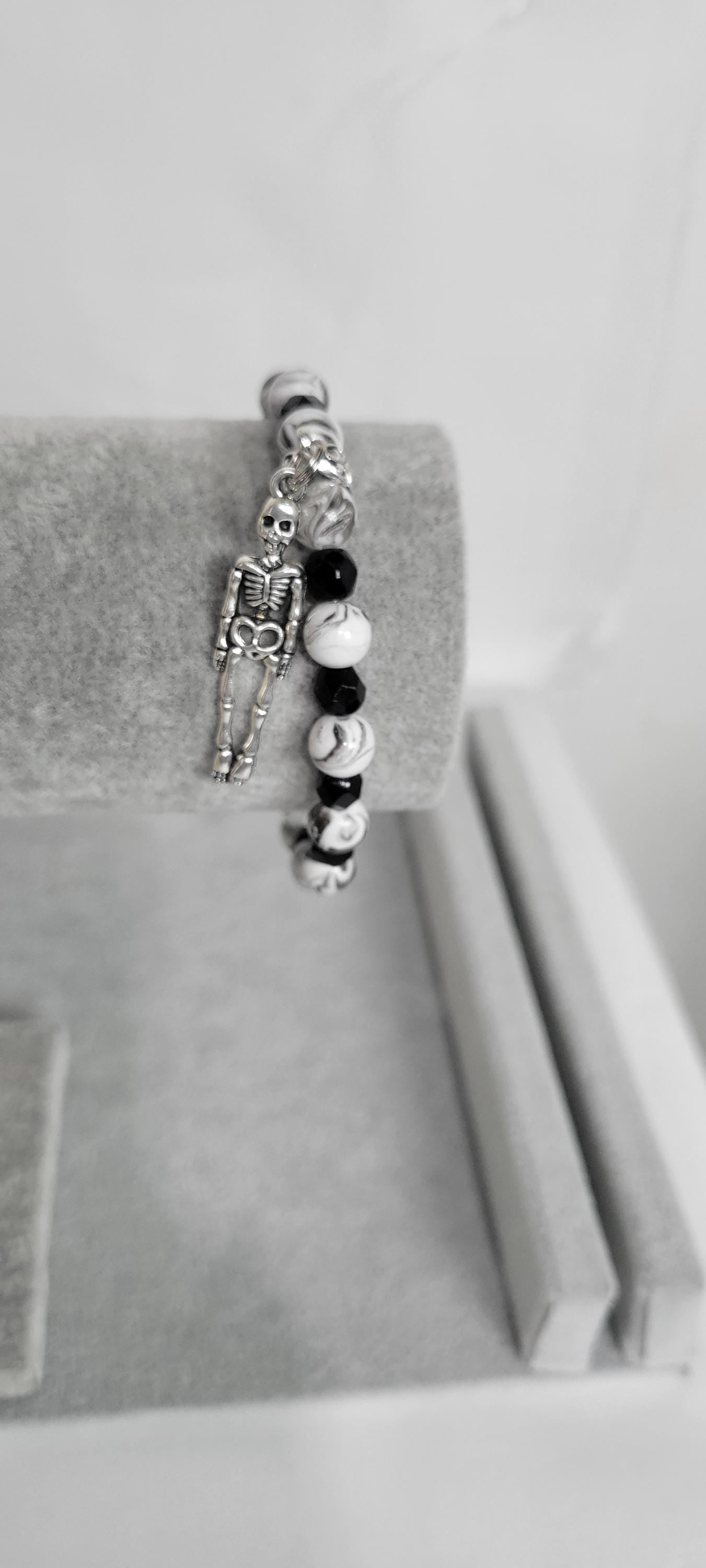Hand crafted black & white crackle beaded skeleton charm bracelet