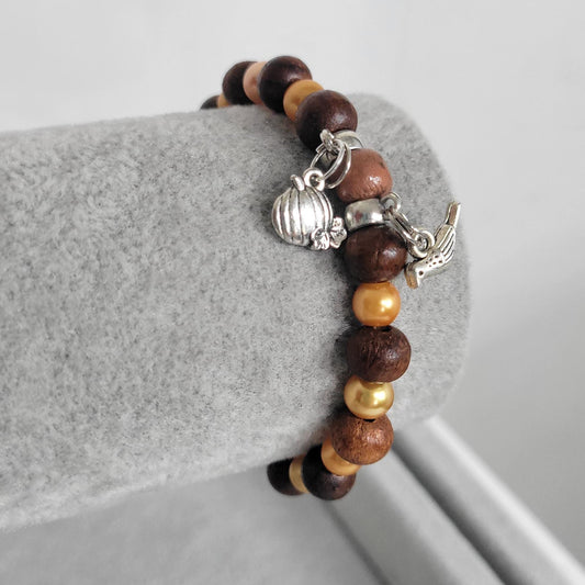 Autumn Fall glass and wood beaded pumpkin and bird charm bracelet
