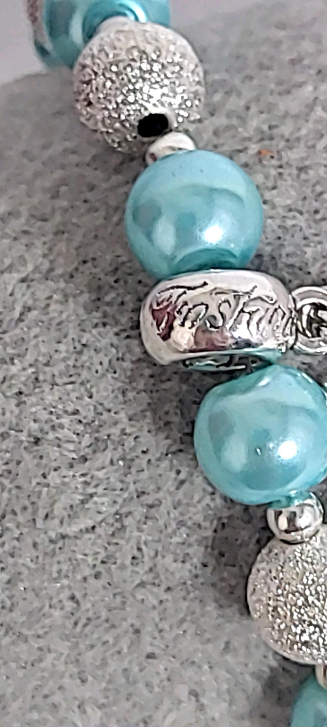 Ice blue glass beaded snowflake charm bracelet