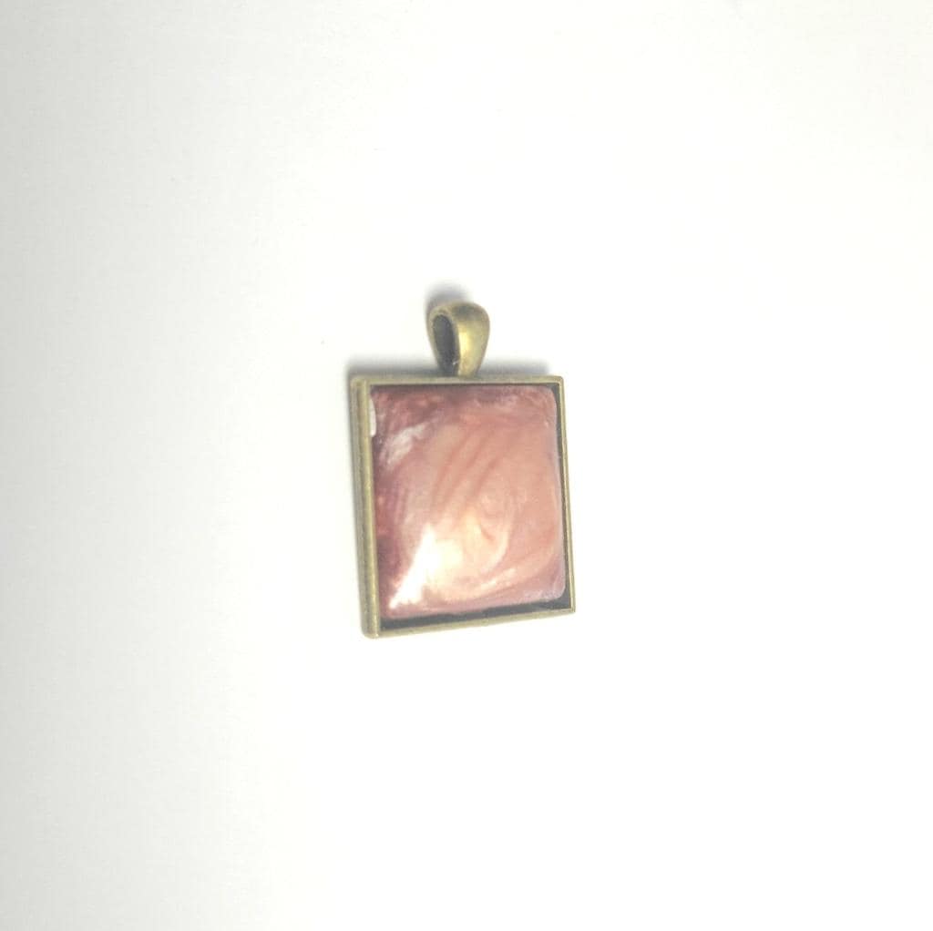 Rose resin bronze tone pendant