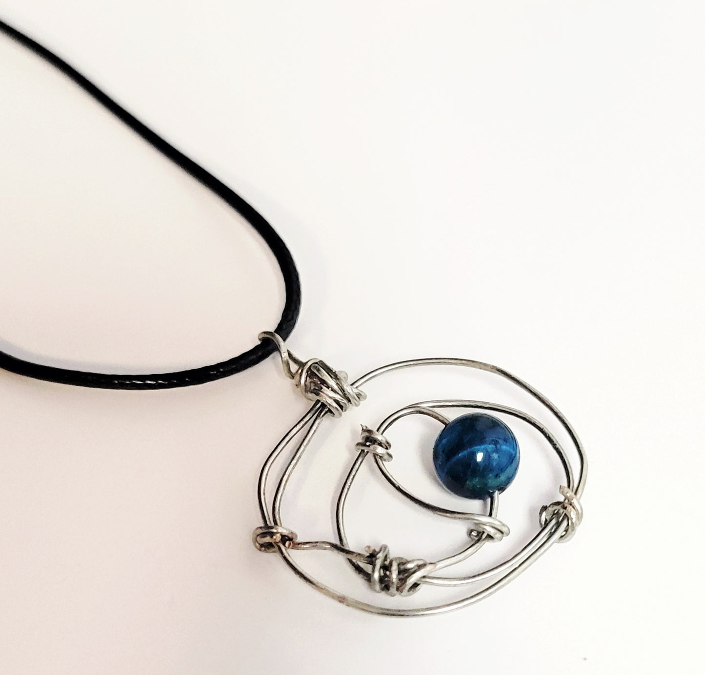 Minimalist knotted wire necklace with dragon vein agate bead